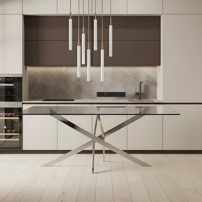 VERDIS modern glass dining table styled in a contemporary kitchen with mirror stainless-steel cross base