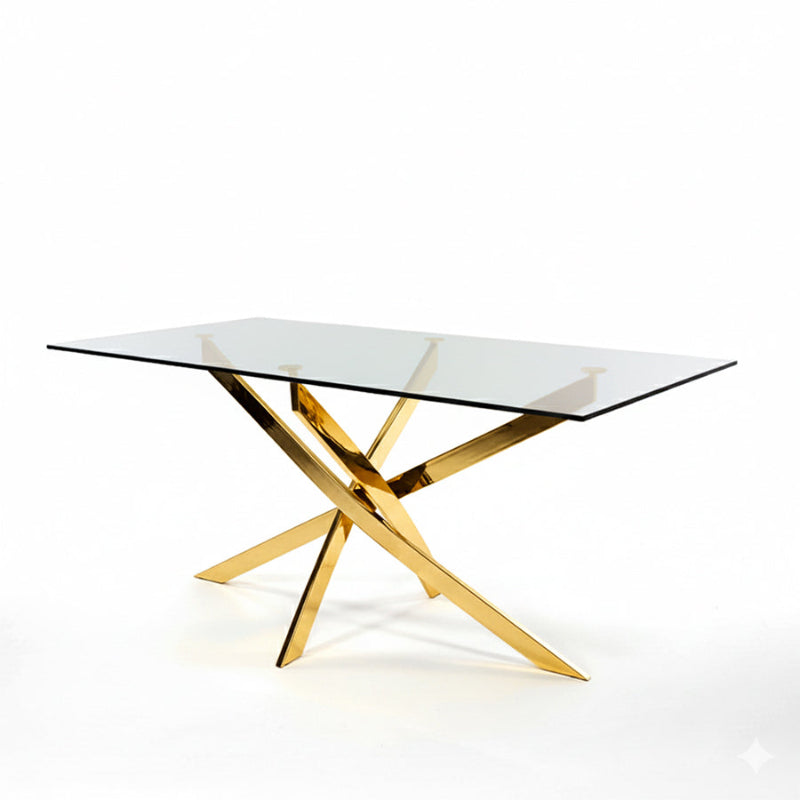 45-degree view of the VERDIS dining table with tempered glass top and polished gold stainless-steel cross base