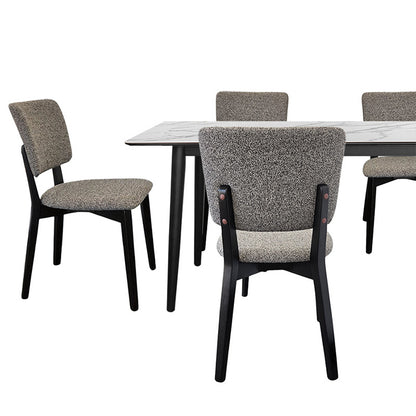 BASK grey fabric dining chair paired with a modern wood dining table featuring a white marble-patterned top.